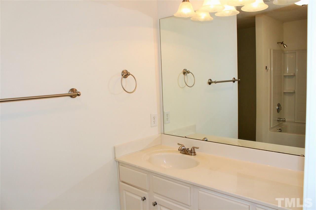 3043 Settle In Lane Raleigh, NC 27614 - Photo 18 of 19 a bathroom with a sink and mirror