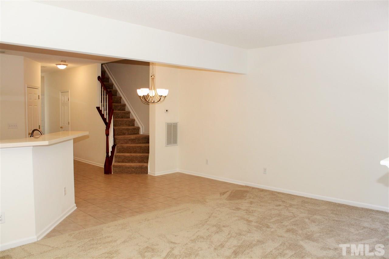 3043 Settle In Lane Raleigh, NC 27614 - Photo 7 of 19 a view of an empty room with stairs