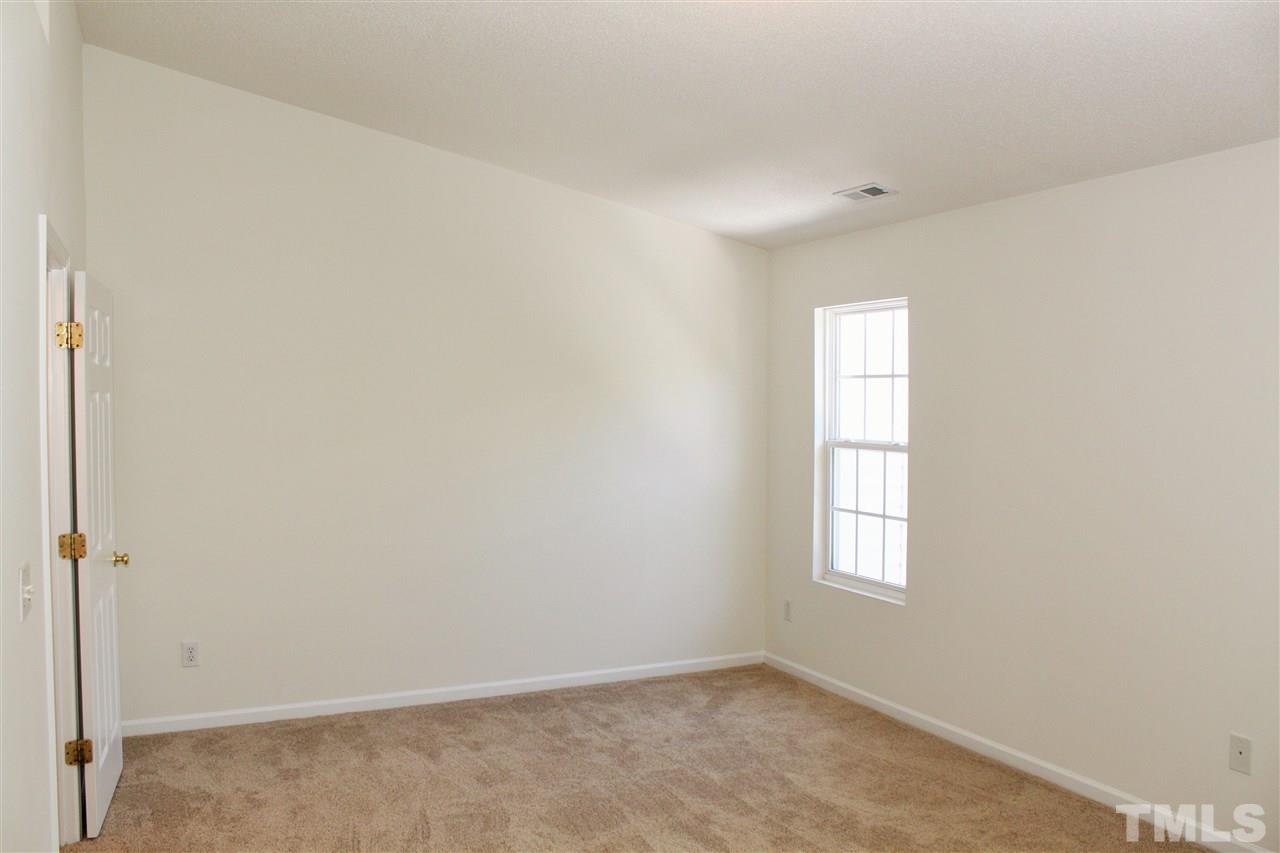 3043 Settle In Lane Raleigh, NC 27614 - Photo 10 of 19 an empty room with windows and closet