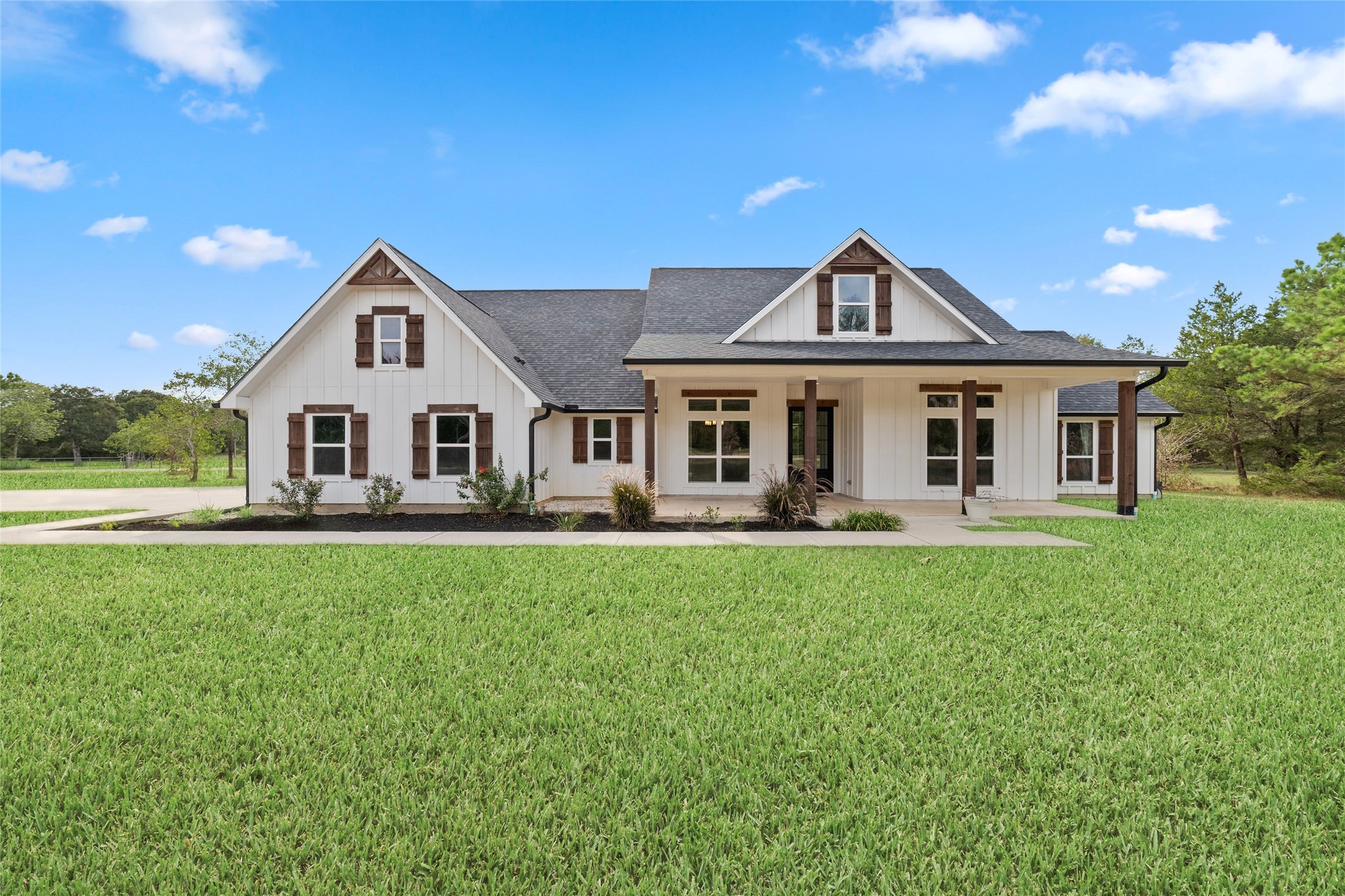 1011 Bonfire West Road Cat Spring, TX 78933 - Photo 1 of 48 Welcome to the country! This home is beautiful inside and out and has all the bells and whistles to make you want to say yes to the address. *Grass color enhanced to show potential.
