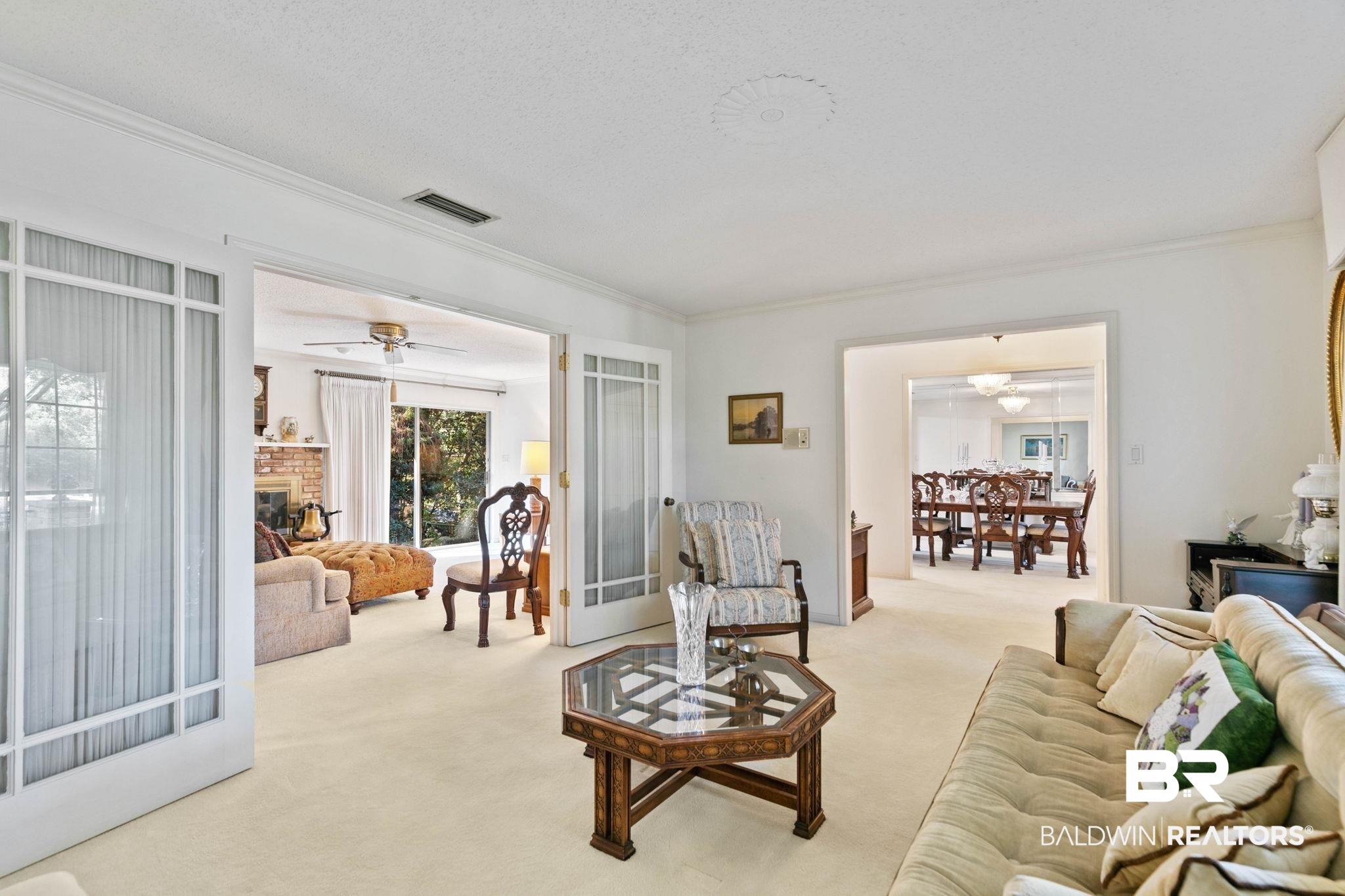 752 Evergreen Street Fairhope, AL 36532 - Photo 5 of 100 Carpeted living area with ceiling fan, a fireplace, ornamental molding, and french doors