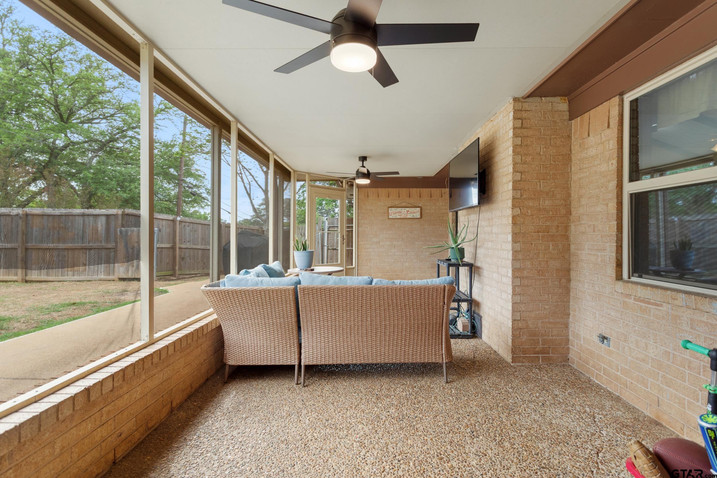 516 Ruthlynn Drive Longview, TX 75605 - Photo 27 of 34 a view of a living room and chandelier fan and kitchen view