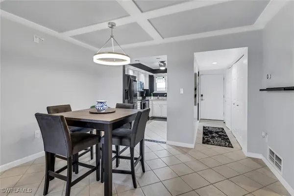 a view of a dining room and a table and chairs