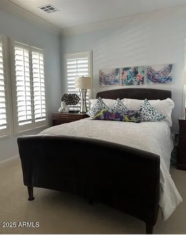 a bedroom with a bed and window