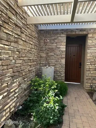 a view of a backyard with potted plants