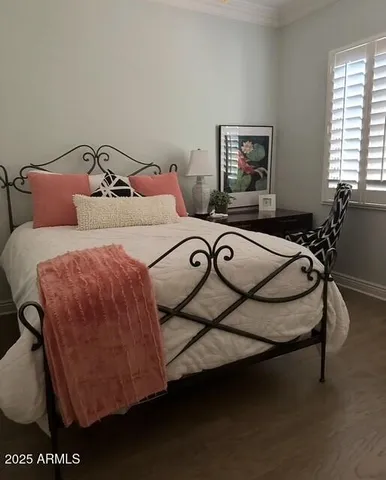 a bedroom with a bed and window