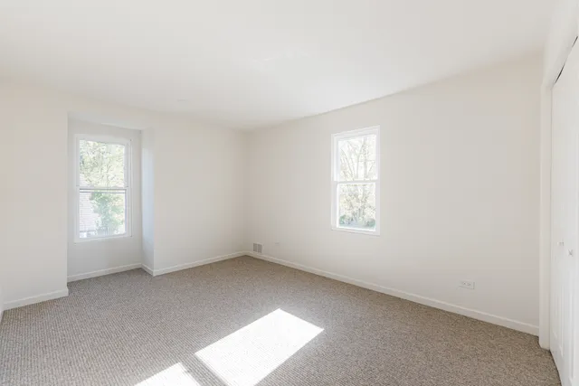 an empty room with windows