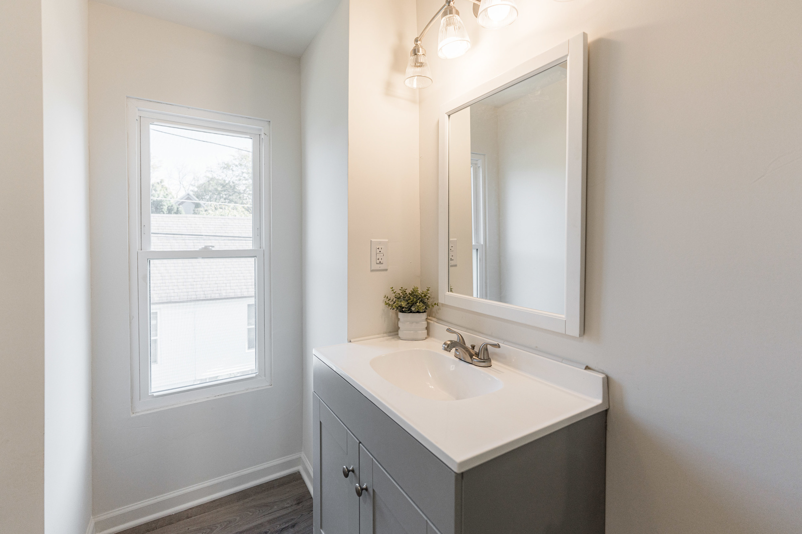 615 Prospect Street DeKalb, IL 60115 - Photo 21 of 27 a bathroom with a sink and a mirror