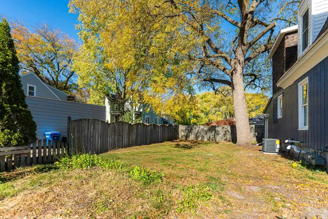 a view of swimming pool with wooden fence