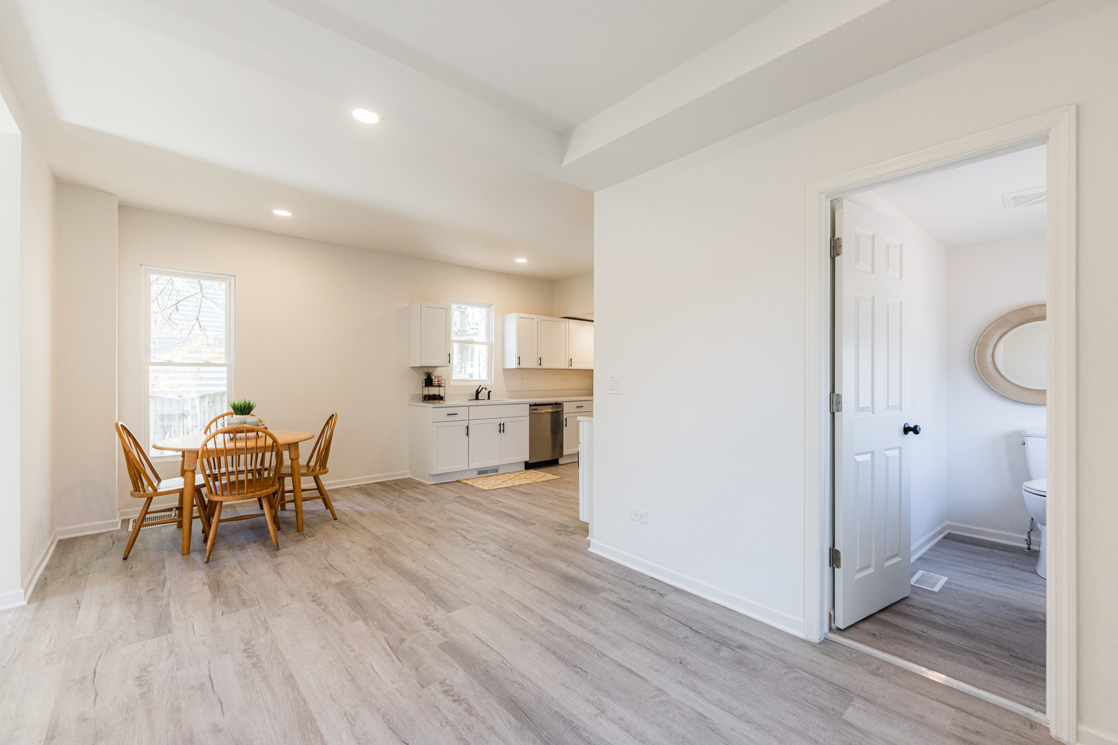 615 Prospect Street DeKalb, IL 60115 - Photo 8 of 27 a view of a dining room with furniture and wooden floor