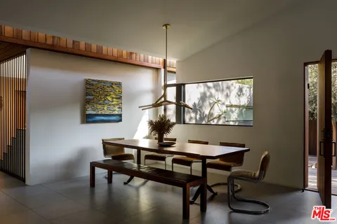 a view of a workspace with furniture