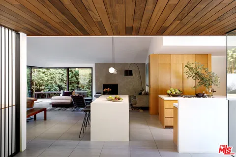 a living room with a sink furniture and a fireplace