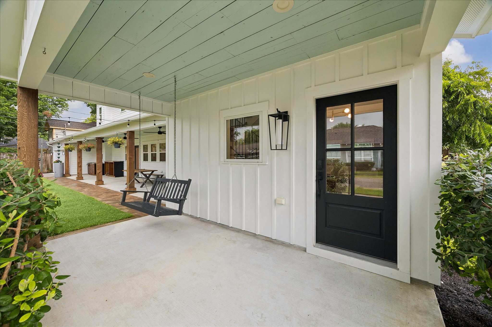 1205 Temple Street Houston, TX 77009 - Photo 5 of 33 The covered patio becomes a true outdoor living room, equally suited for quiet morning coffee, relaxed evenings, or hosting friends year-round.