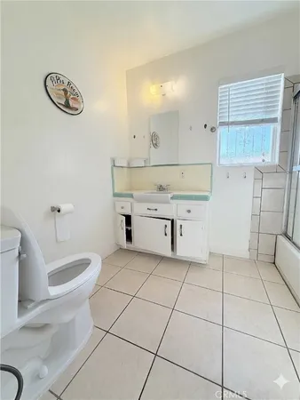a room with a sink cabinets and utility room