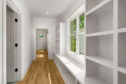 a view of a bathroom with a tub and windows