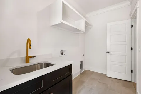 a kitchen with a sink and cabinets