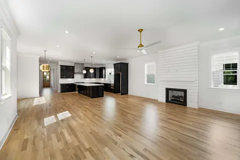 a view of kitchen with cabinets and wooden floor