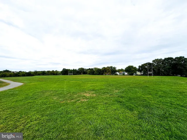 a view of field with ocean view