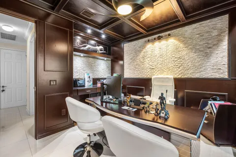a bathroom with a granite countertop sink a toilet a mirror and shower