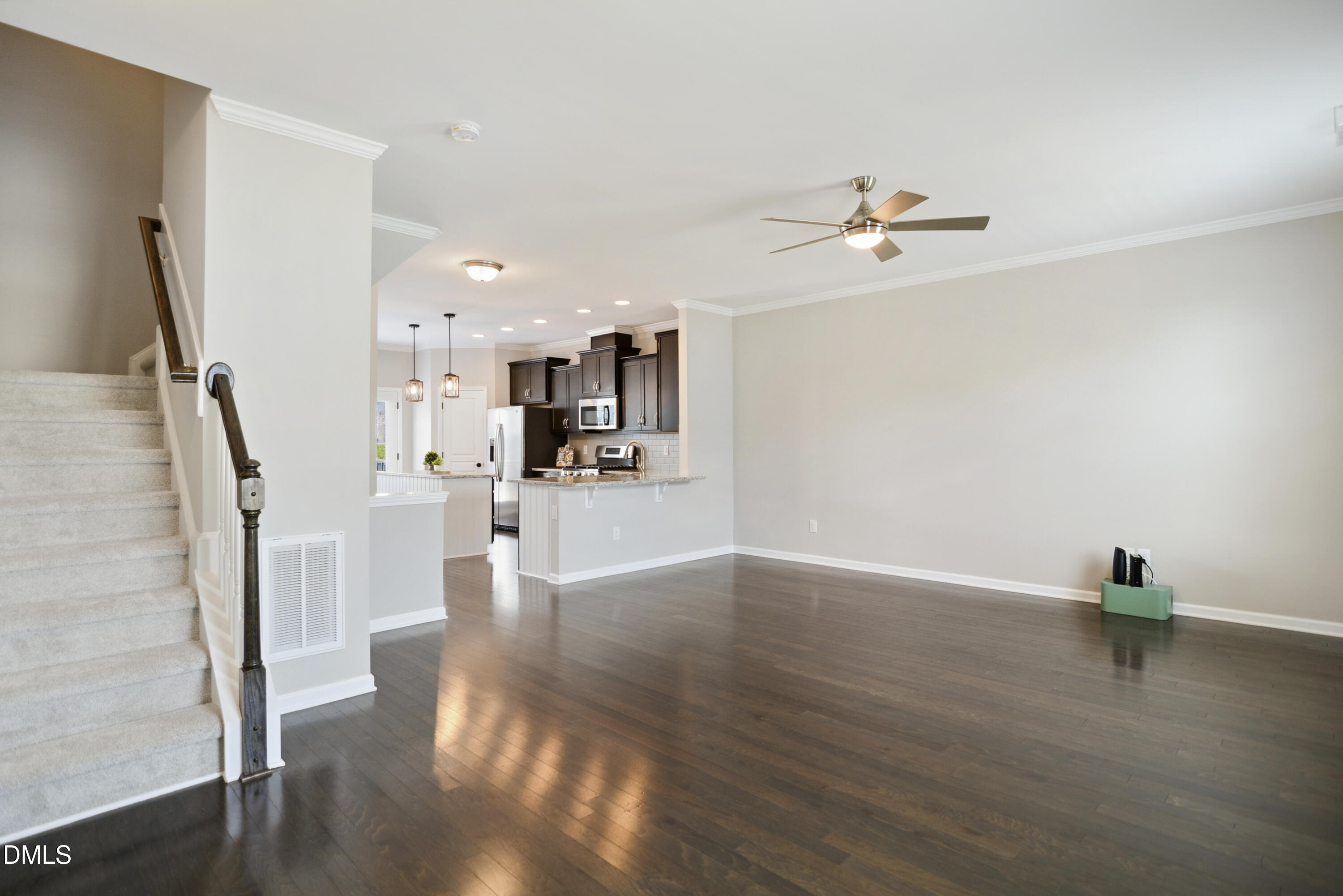 5916 Giddings Street Raleigh, NC 27616 - Photo 7 of 49 a view of empty room with wooden floor and fan