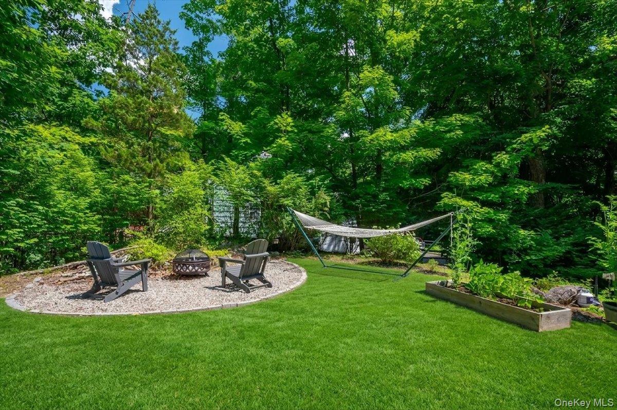 105 High St Extension Mount Kisco, NY 10549 - Photo 5 of 38 a view of a table and chairs in the garden