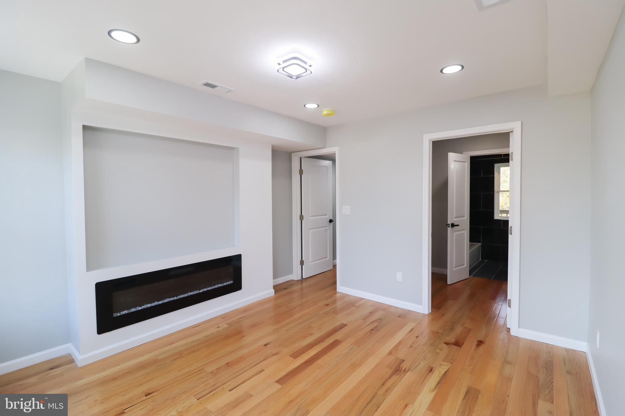 504 North Schroeder Street Baltimore, MD 21223 - Photo 12 of 31 wooden floor in an empty room with a window