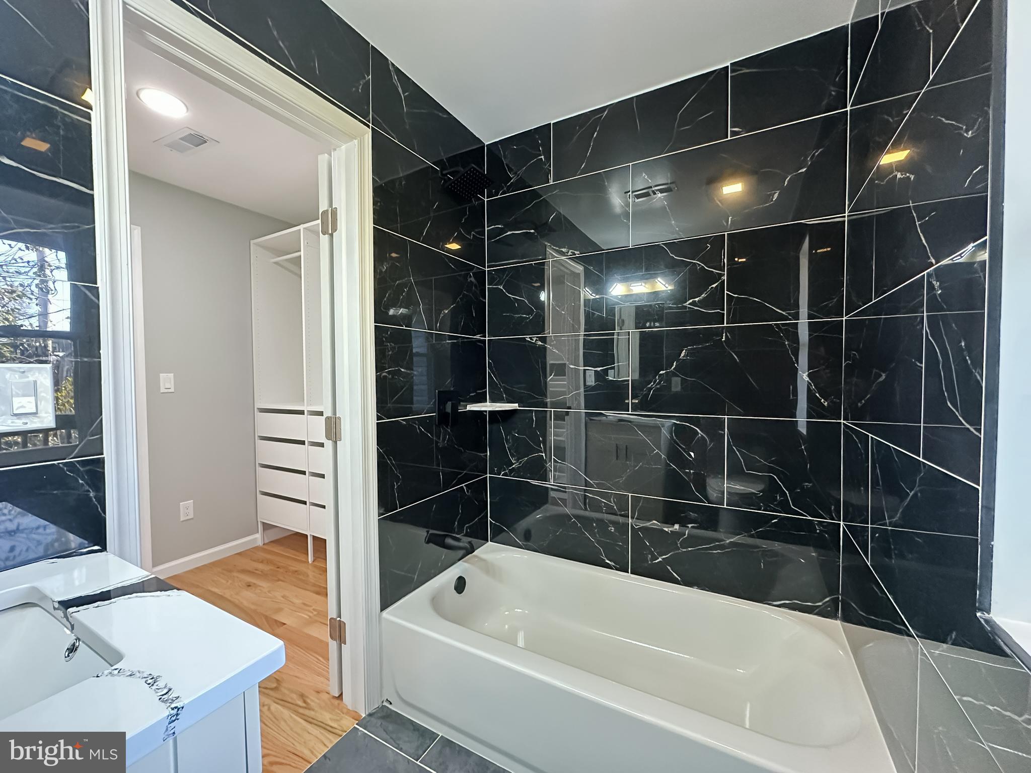 504 North Schroeder Street Baltimore, MD 21223 - Photo 16 of 31 a bathroom with a bathtub and a shower