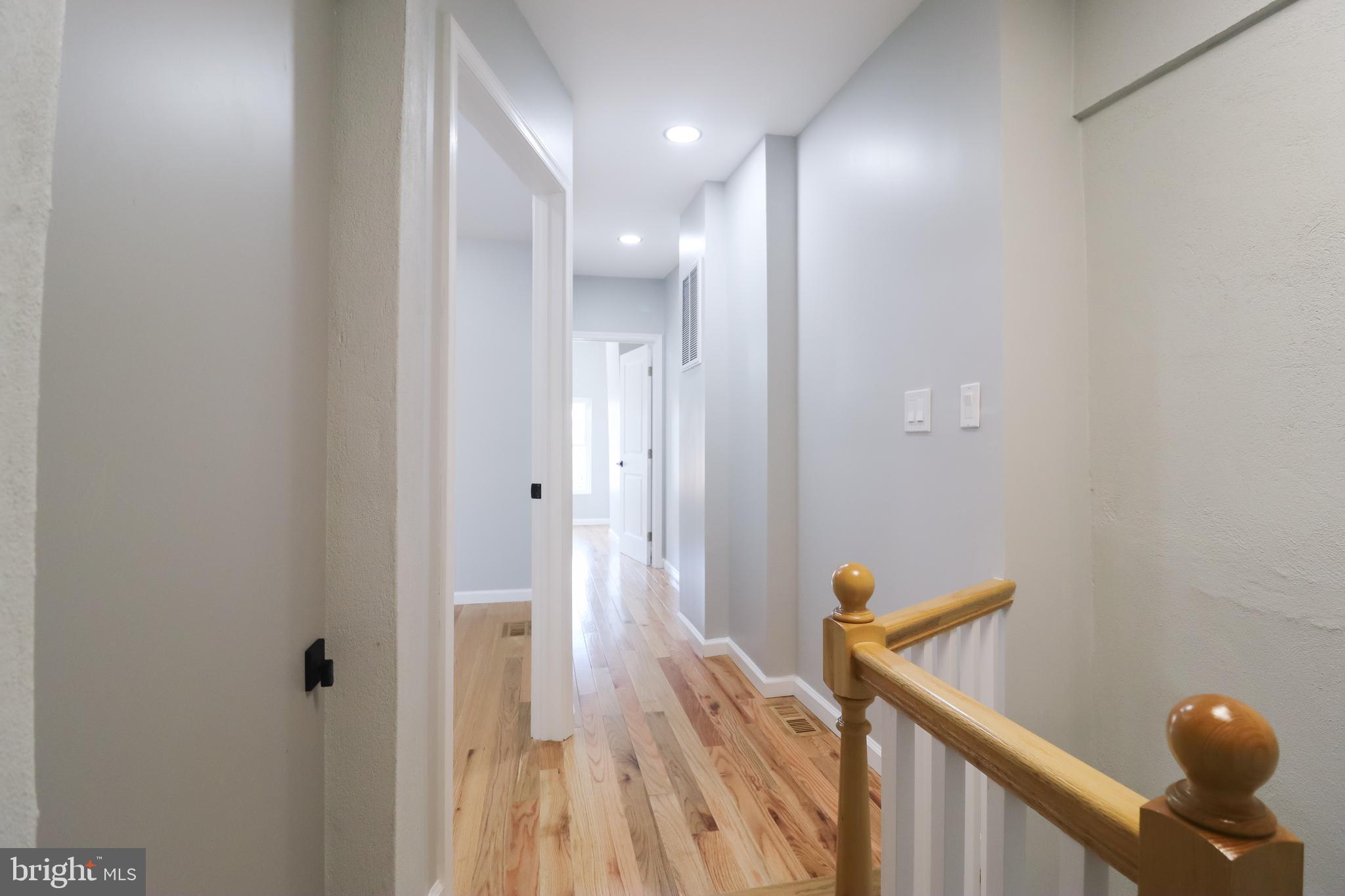 504 North Schroeder Street Baltimore, MD 21223 - Photo 17 of 31 a view of a hallway with wooden floor