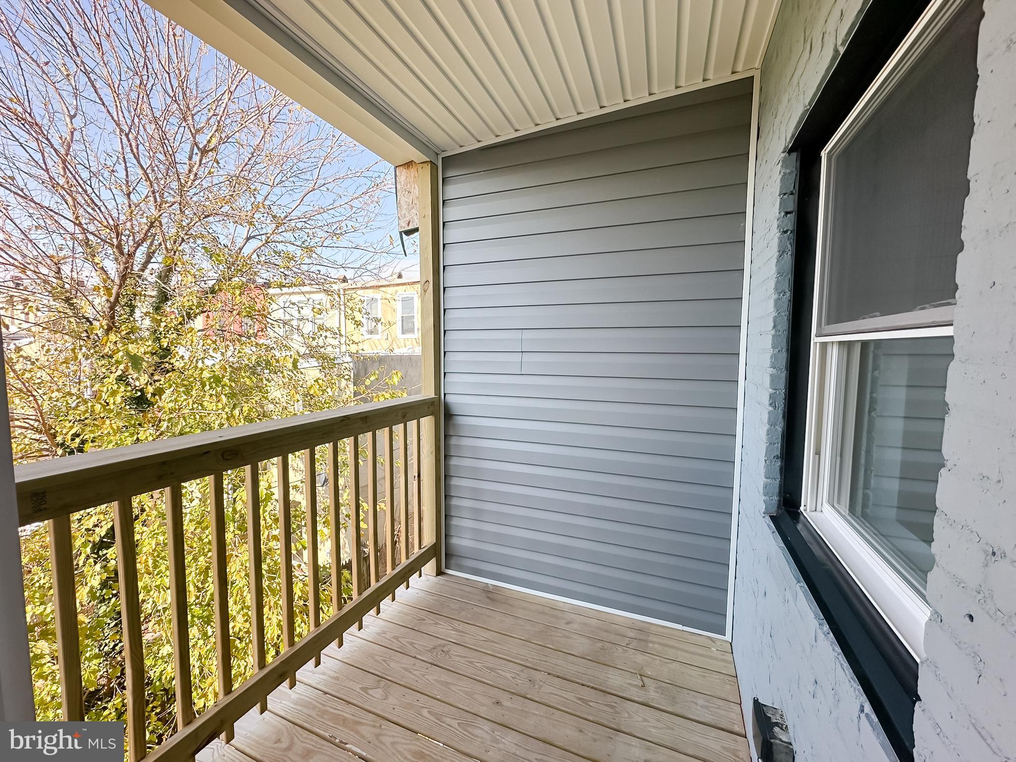 504 North Schroeder Street Baltimore, MD 21223 - Photo 18 of 31 a view of a balcony with wooden floor
