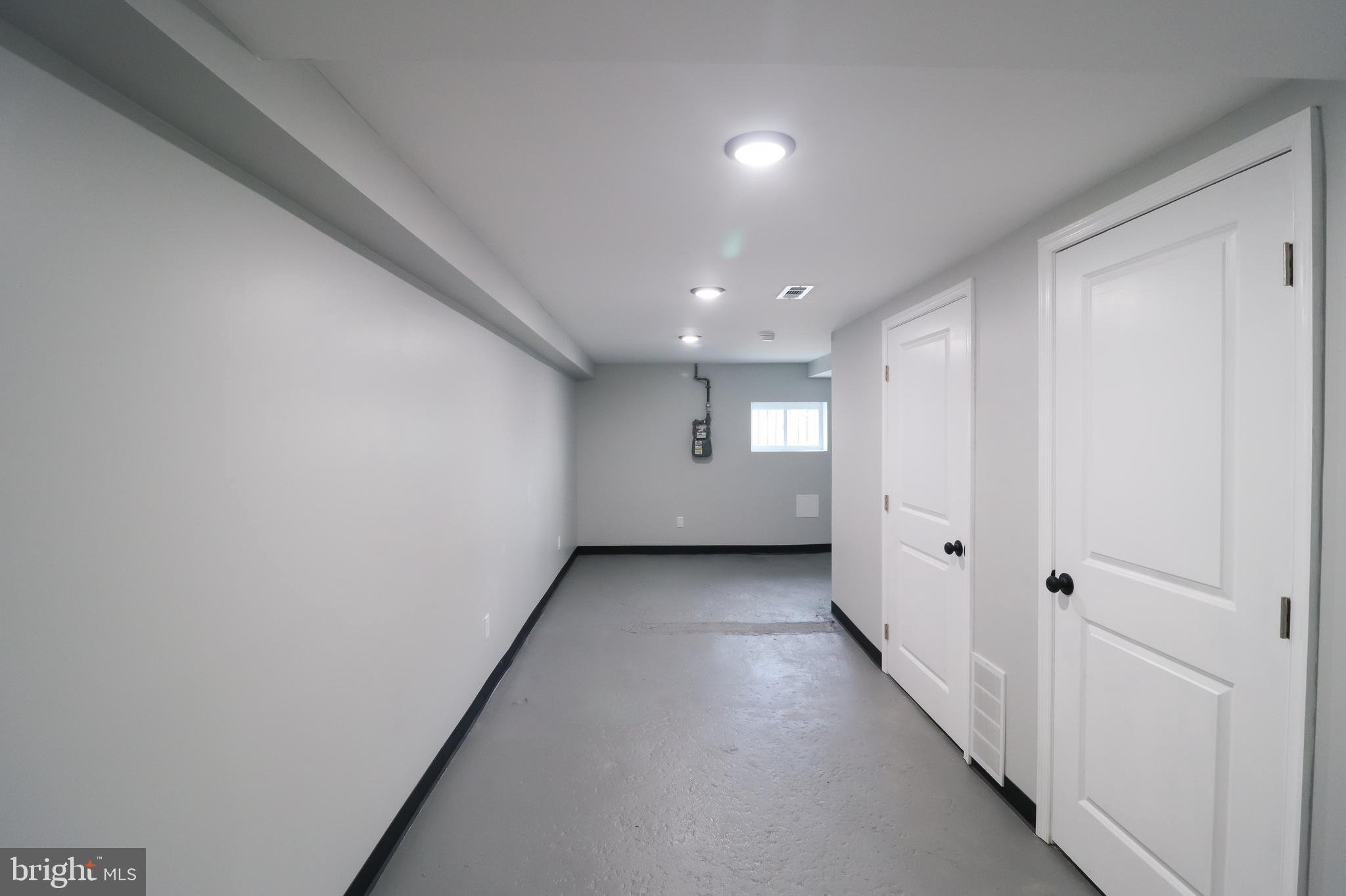 504 North Schroeder Street Baltimore, MD 21223 - Photo 25 of 31 a view of a hallway with wooden floor and windows