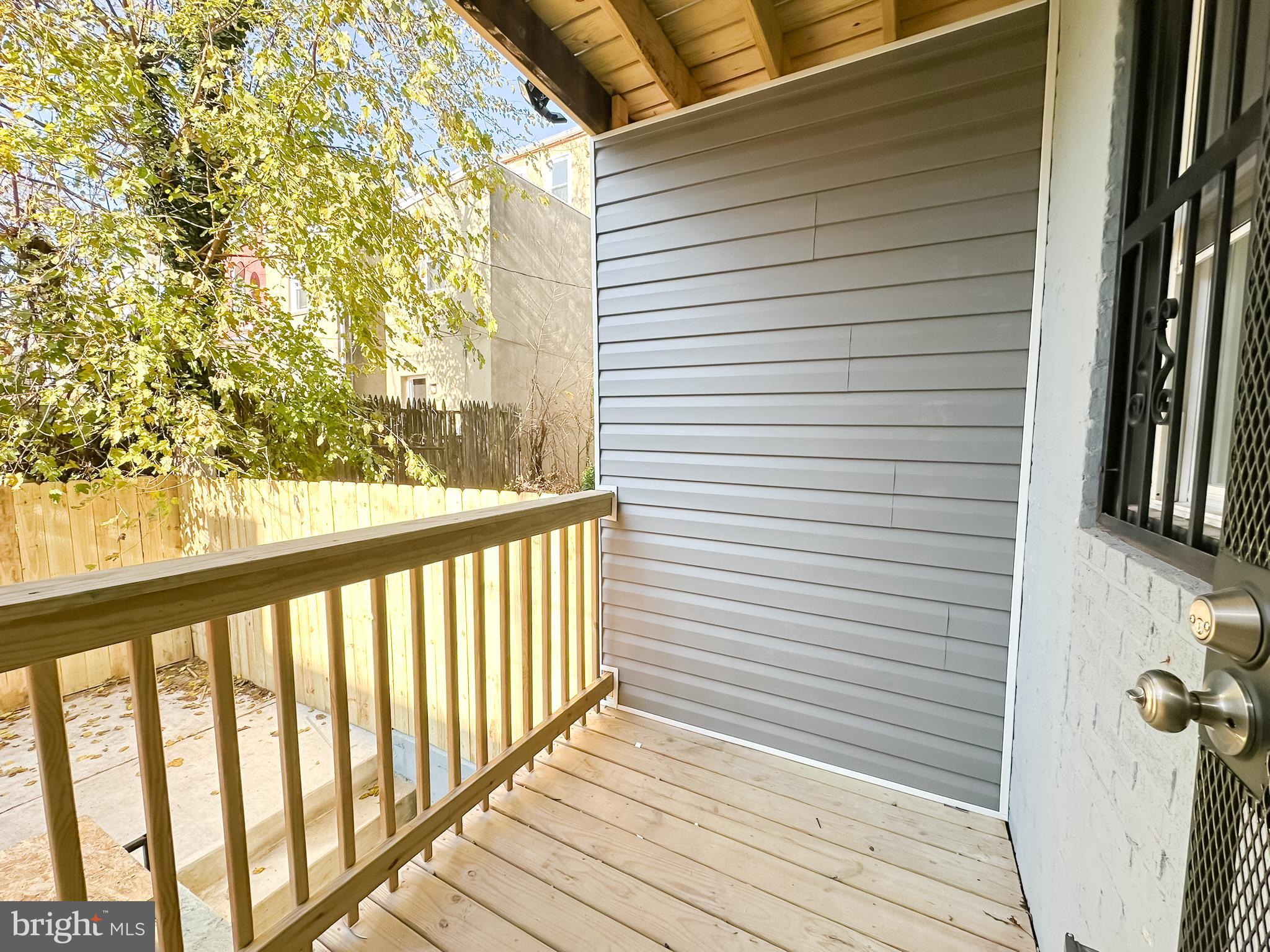 504 North Schroeder Street Baltimore, MD 21223 - Photo 7 of 31 a view of a balcony with wooden floor
