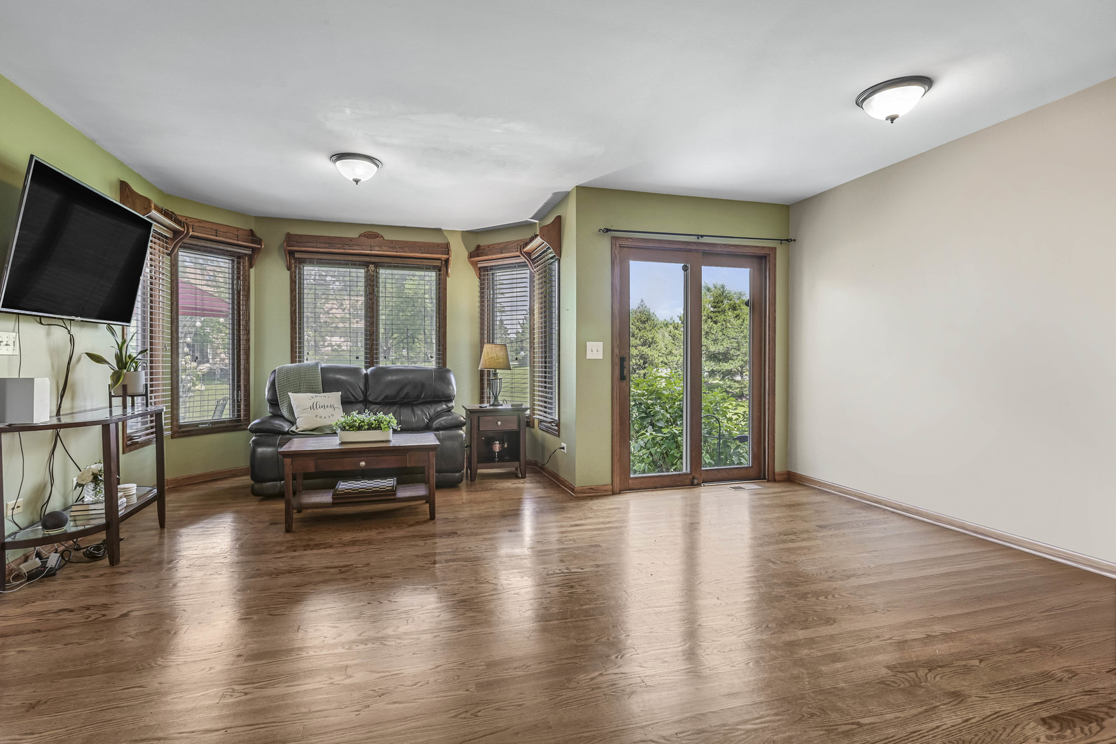 173 Harper Lane Lemont, IL 60439 - Photo 15 of 36 a living room with furniture and a flat screen tv