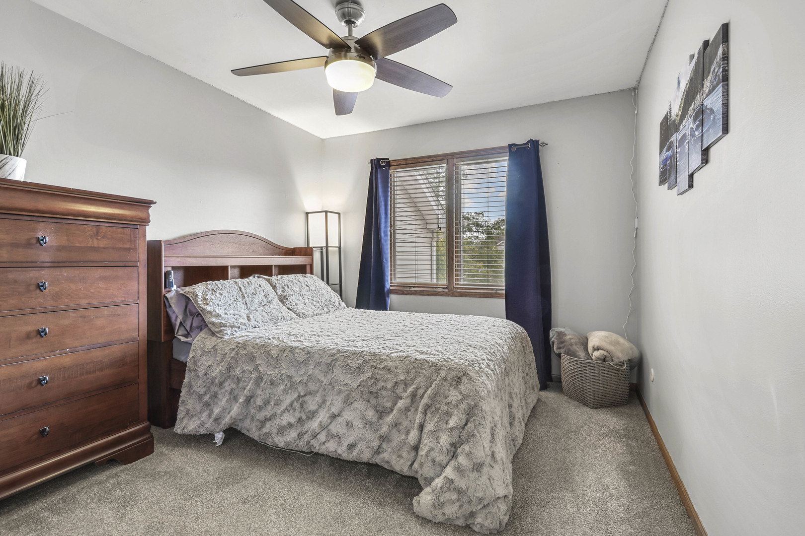 173 Harper Lane Lemont, IL 60439 - Photo 23 of 36 a bedroom with a bed and a chandelier