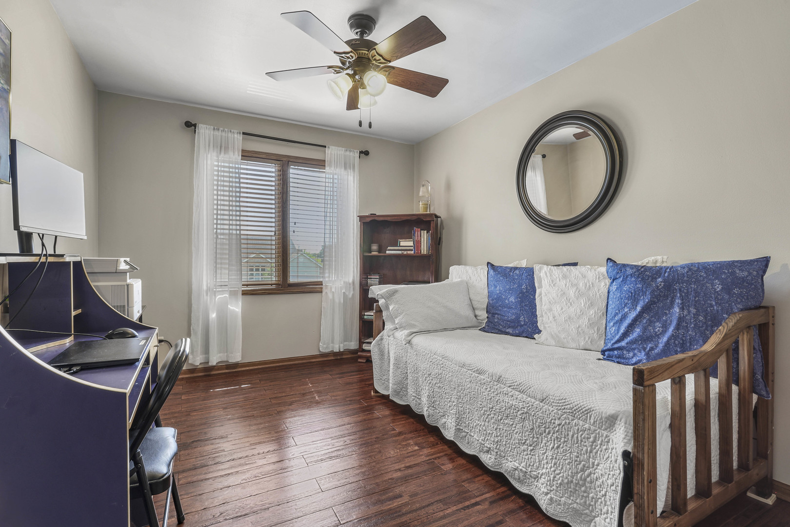 173 Harper Lane Lemont, IL 60439 - Photo 24 of 36 a living room with couches a fireplace and a chandelier