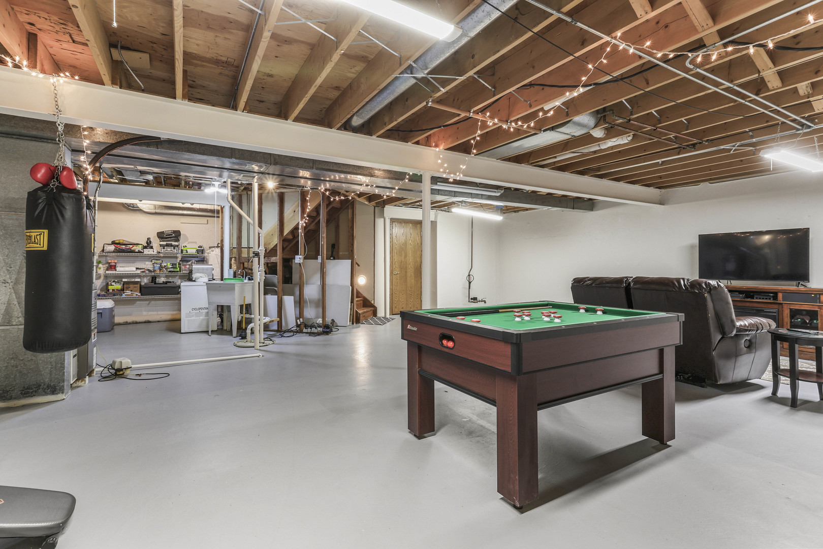 173 Harper Lane Lemont, IL 60439 - Photo 28 of 36 a room with gym equipment and a view of store