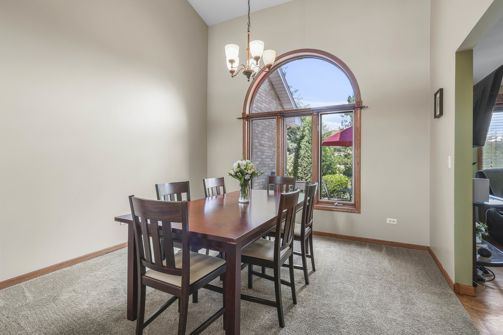 173 Harper Lane Lemont, IL 60439 - Photo 10 of 36 a dining room with furniture a potted plant and a chandelier