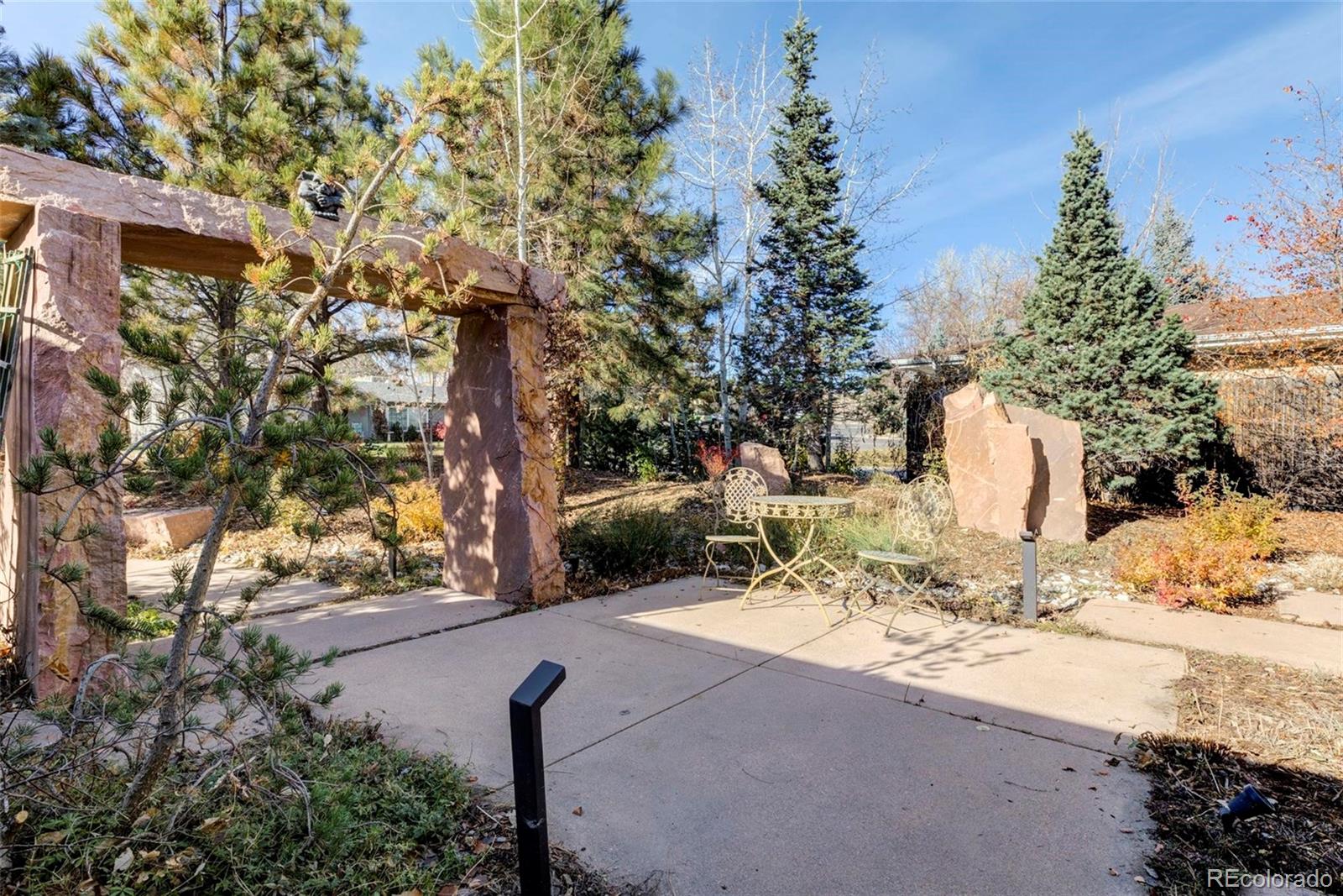3170 Wright Street Wheat Ridge, CO 80215 - Photo 5 of 29 a view of a yard with a tree
