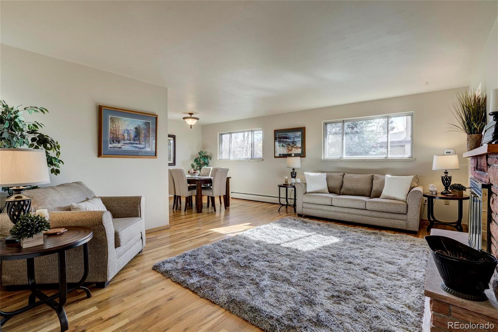 3170 Wright Street Wheat Ridge, CO 80215 - Photo 8 of 29 a living room with furniture and a rug