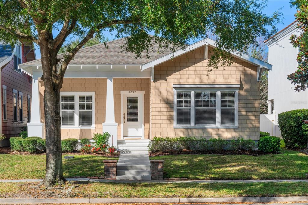 2976 St George Street Orlando, FL 32814 - Photo 1 of 1 a front view of a house with garden