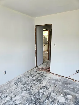 an empty room with a bench