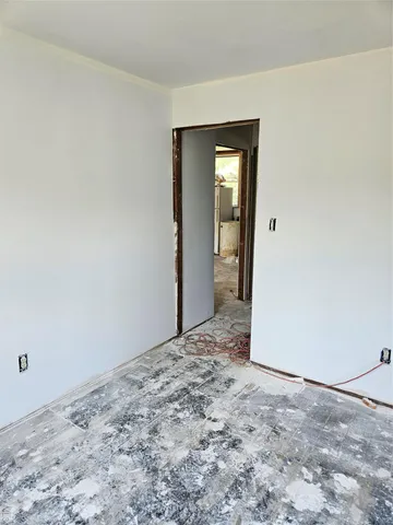 an empty room with a bench