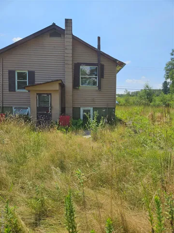 a house view with a backyard space