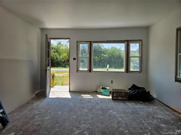 a room with a bed and a window