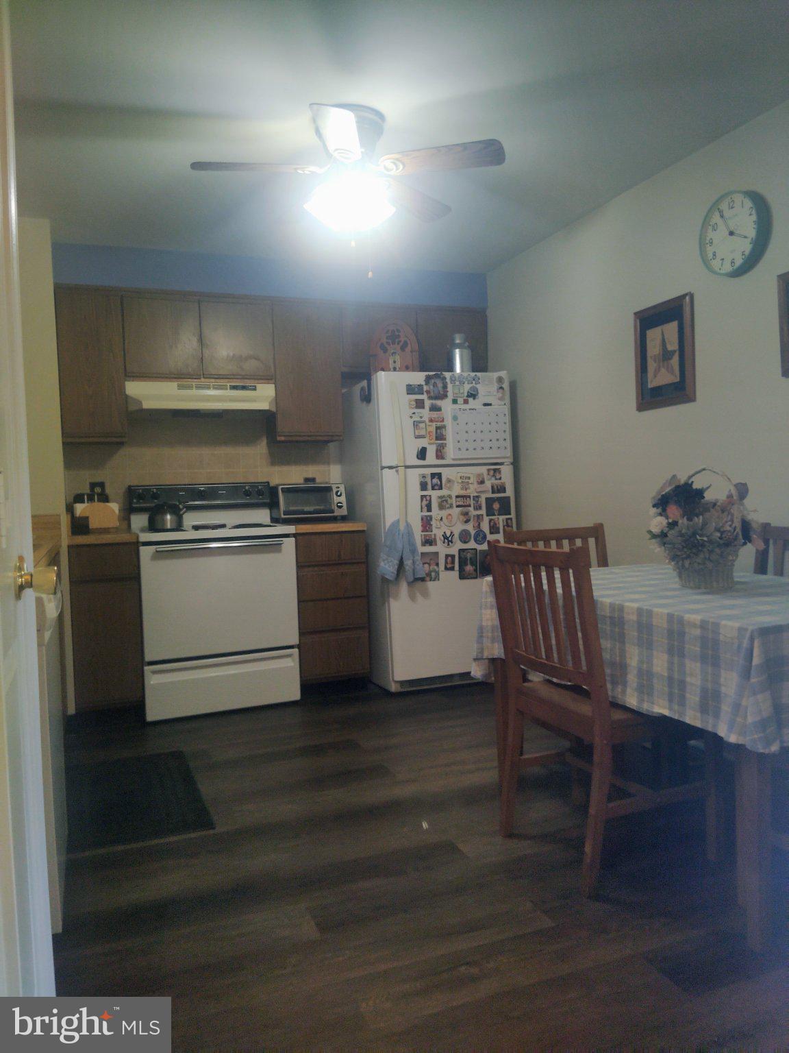 69 Johnson Smithsburg, MD 21783 - Photo 15 of 39 a kitchen with kitchen island a stove a table and chairs