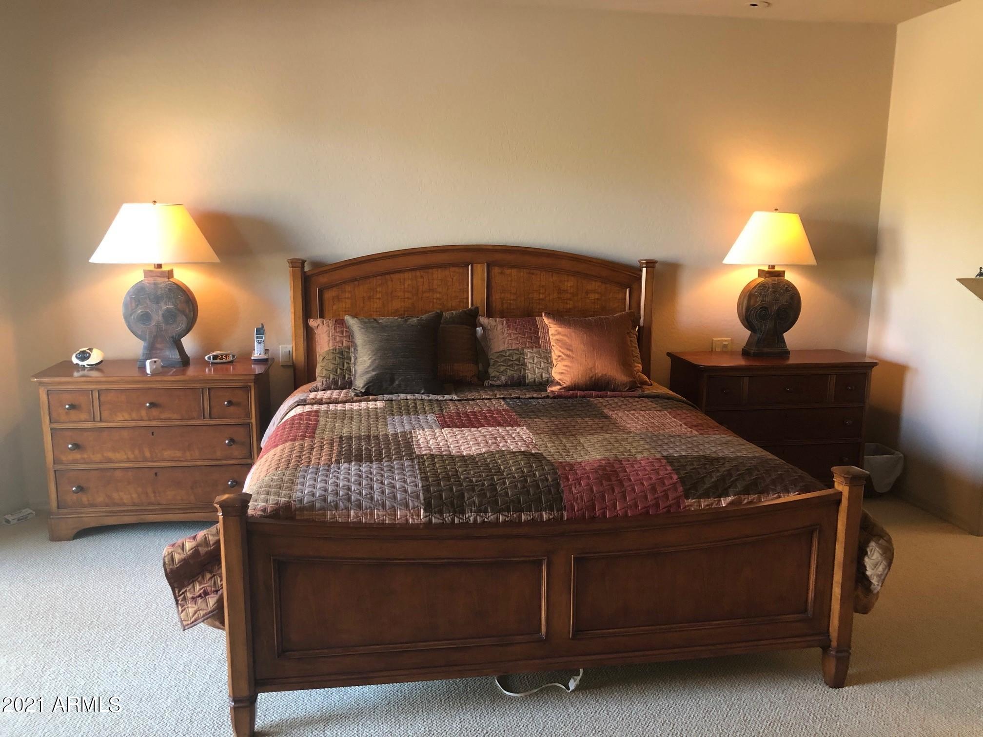 27707 North Quail Spring Road Rio Verde, AZ 85263 - Photo 6 of 14 a bedroom with a bed and lamp with lamp