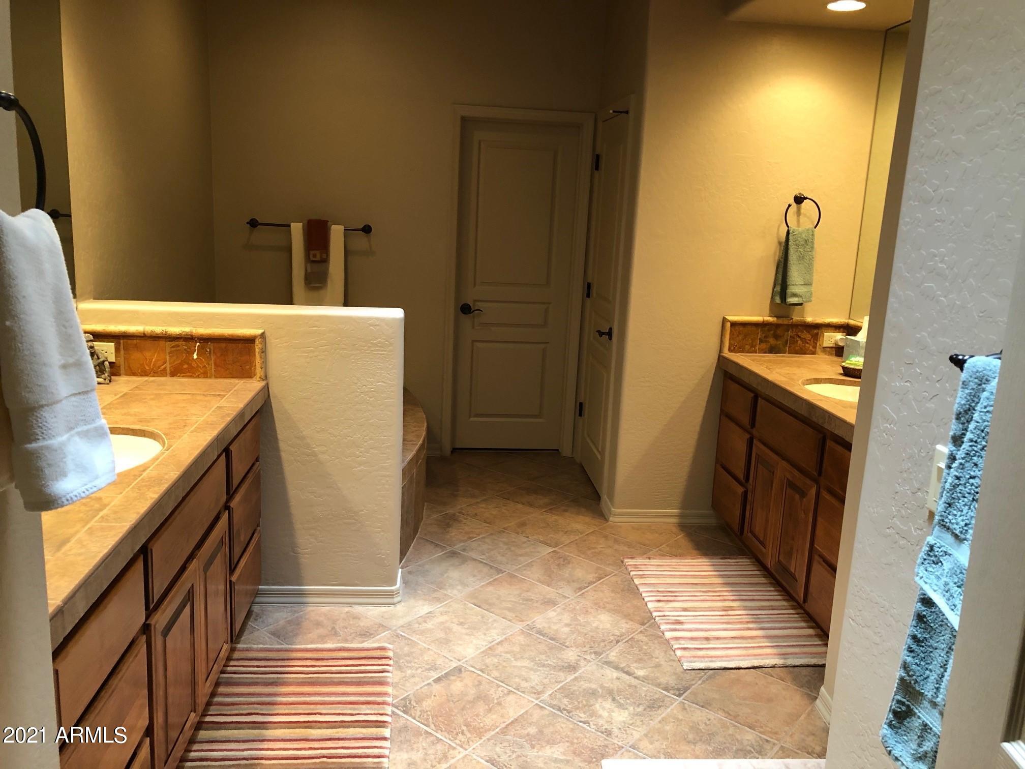 27707 North Quail Spring Road Rio Verde, AZ 85263 - Photo 7 of 14 a view of a bathroom with mirror and a sink