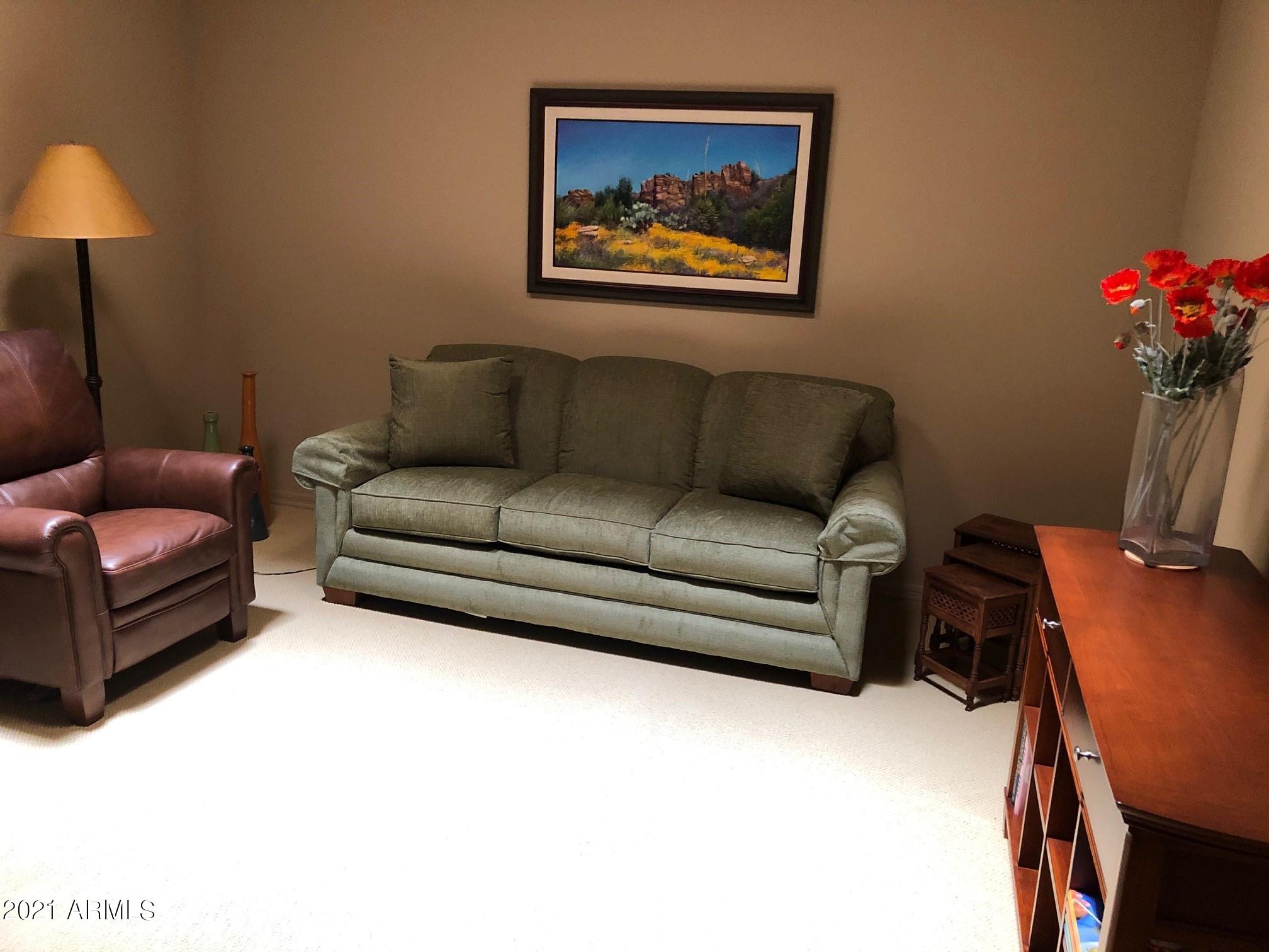27707 North Quail Spring Road Rio Verde, AZ 85263 - Photo 8 of 14 a living room with furniture and a couch