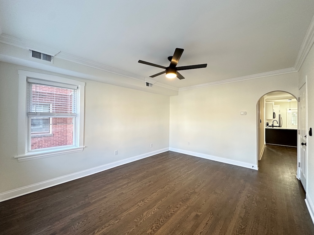 3045 West Addison Street, Unit 1 Chicago, IL 60618 - Photo 13 of 20 a view of a livingroom with wooden floor and a ceiling fan