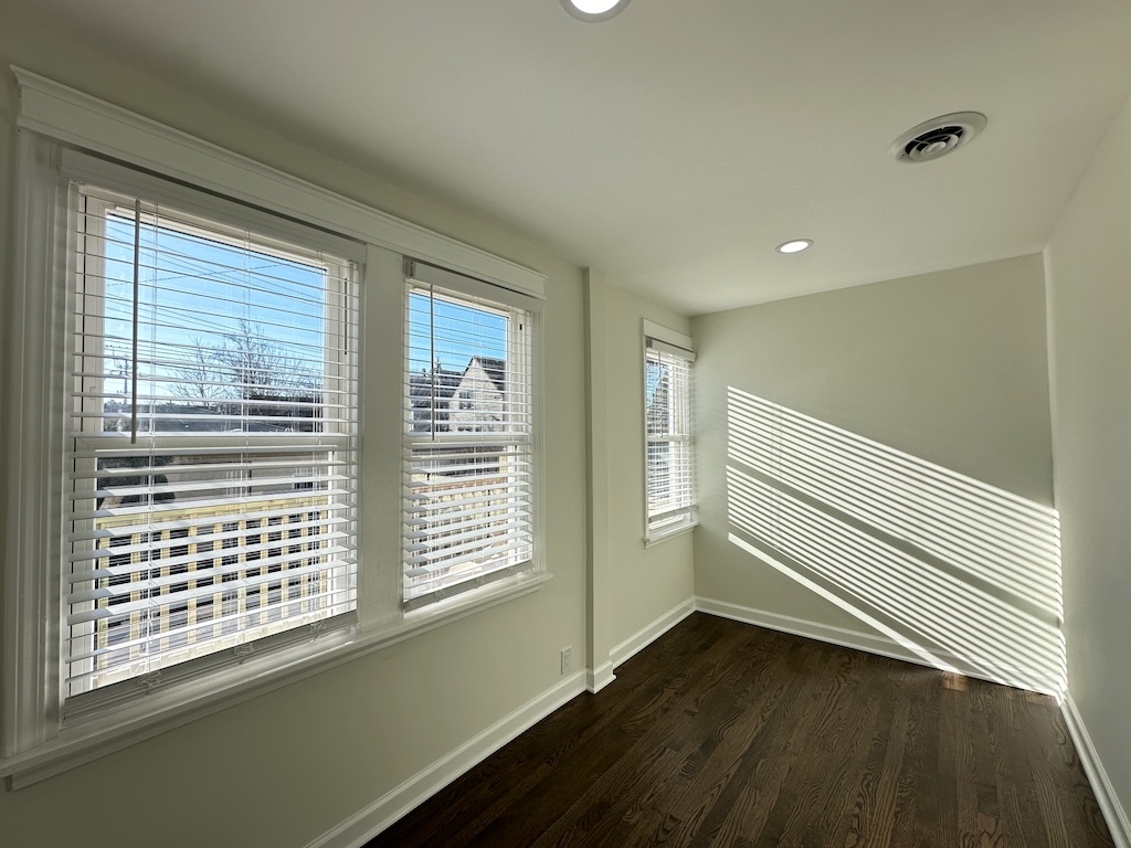 3045 West Addison Street, Unit 1 Chicago, IL 60618 - Photo 18 of 20 a view of a room with wooden floor and windows