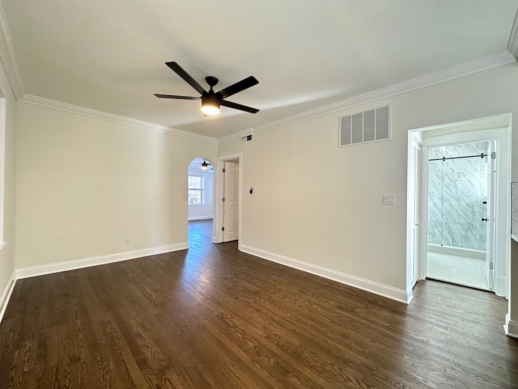 3045 West Addison Street, Unit 1 Chicago, IL 60618 - Photo 9 of 20 an empty room with wooden floor and windows